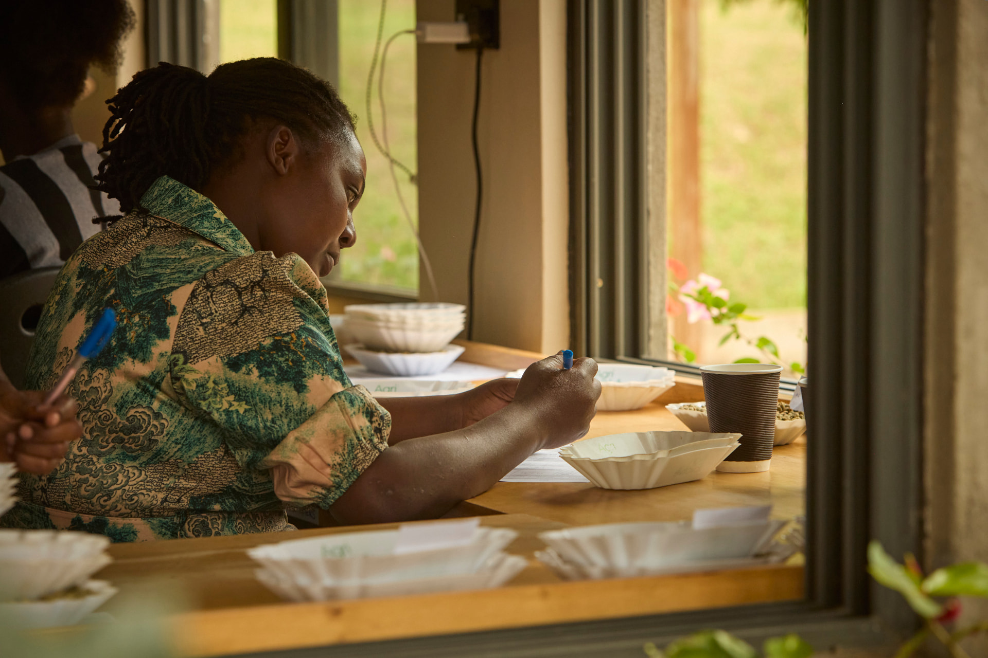 Coffee being evaluated during cupping in Uganda